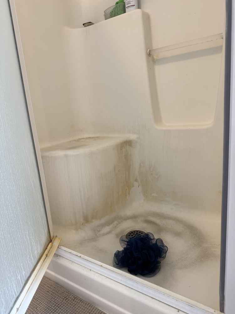 Shower stall before cleaning